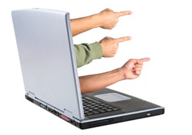 finger pointing from a laptop